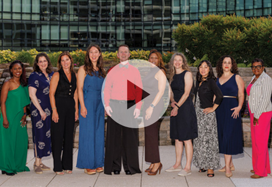 Fellows standing side by side smiling for camera