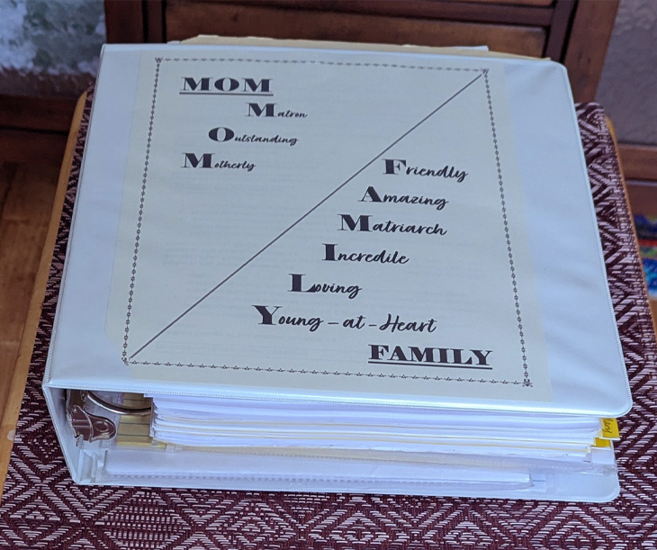 White binder with a decorative &lsquo;MOM&rsquo; and &lsquo;FAMILY&rsquo; cover page