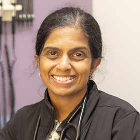 Headshot of smiling doctor.