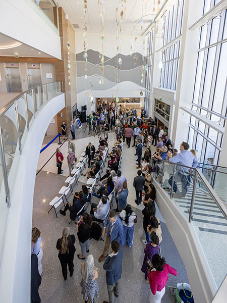 A large group of people gathers at the Folsom Medical care clinic