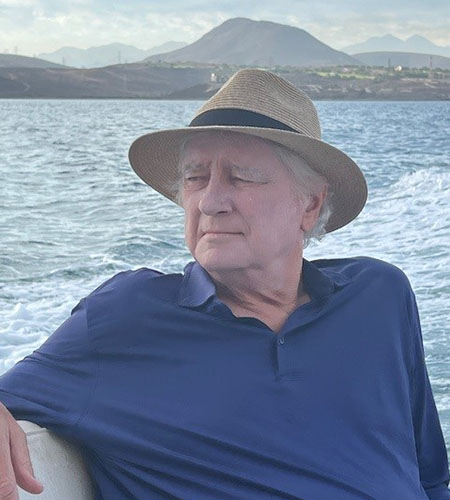 a man on a boat with a cane