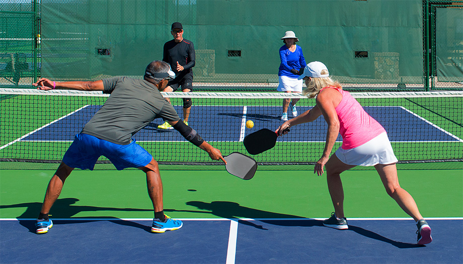 couples playing pickleball