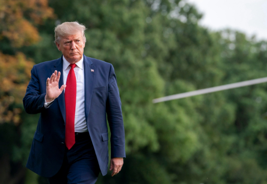 Donald Trump walking and waving.  