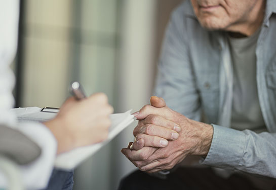 patient and doctor in medical office.