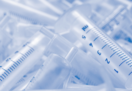 Used plastic syringes