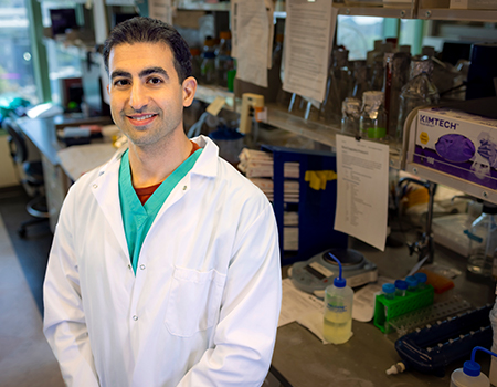 Pediatric neurosurgeon Cameron Sadegh stands in his Brain Fluids Lab.