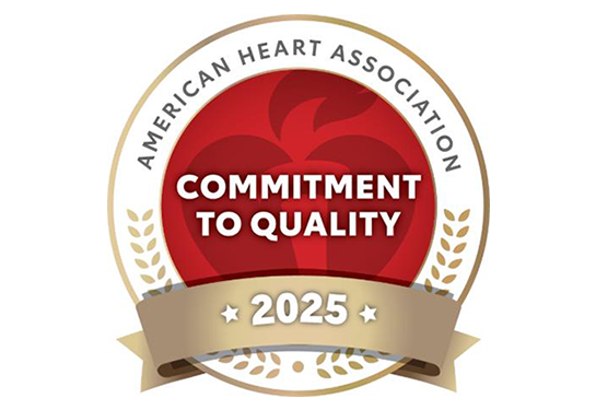 Round logo with a heart in the middle that says commitment to quality in the middle.